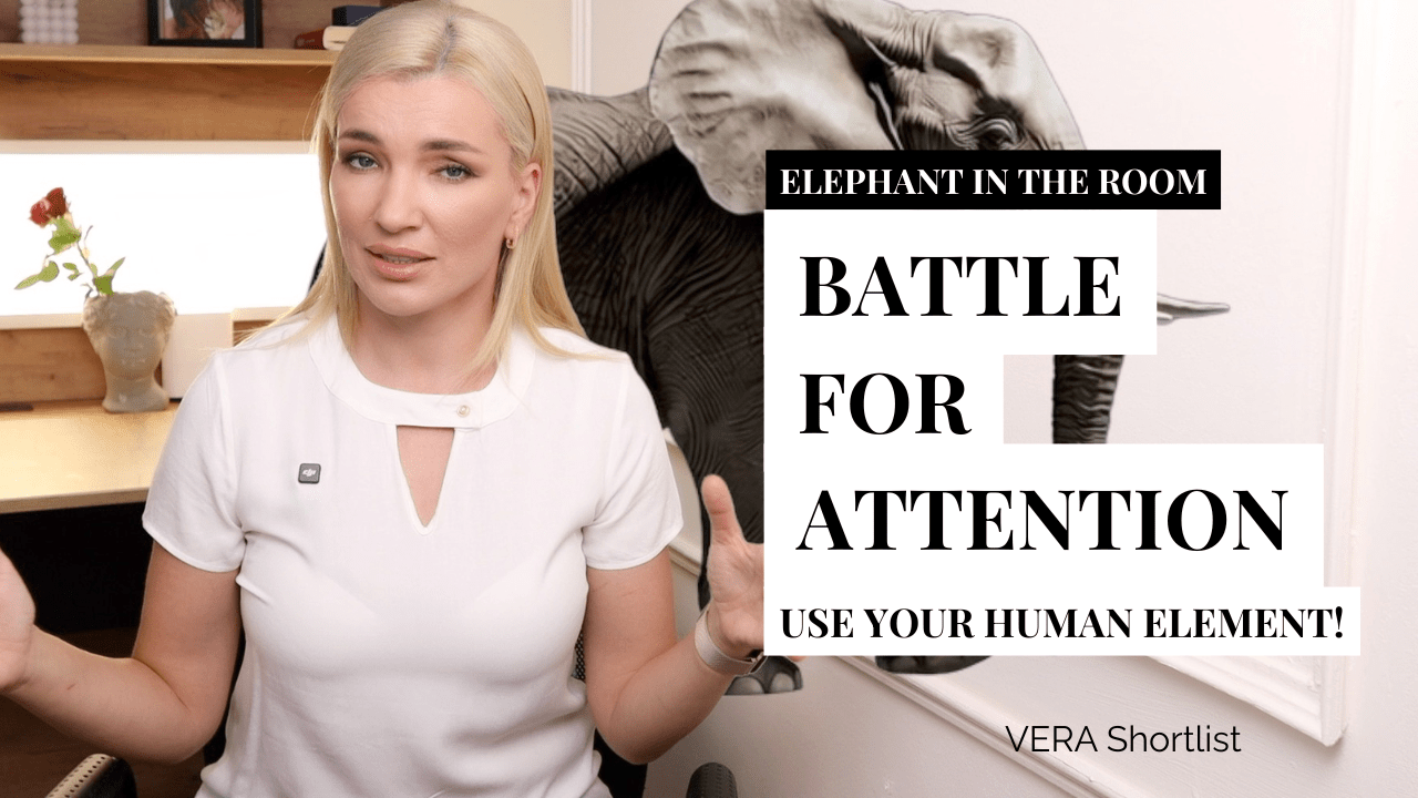 Presenter in a modern office setting with an elephant illustration behind and overlay text ‘Battle for Attention: Use Your Human Element!